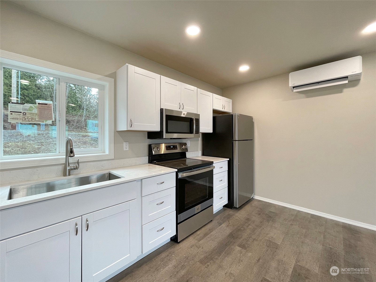 2023 Atterberry Road Sequim, WA 98382 - Photo 12 of 40 a kitchen with appliances a sink and cabinets