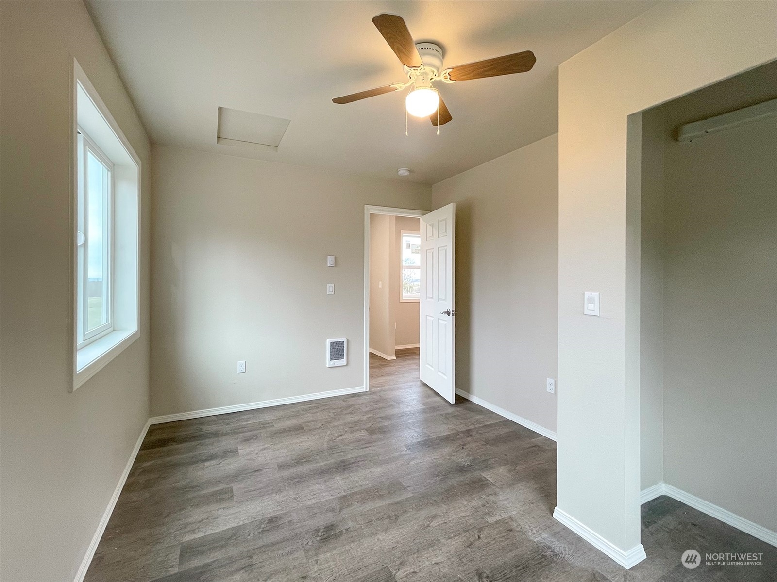 2023 Atterberry Road Sequim, WA 98382 - Photo 20 of 40 an empty room with wooden floor and windows