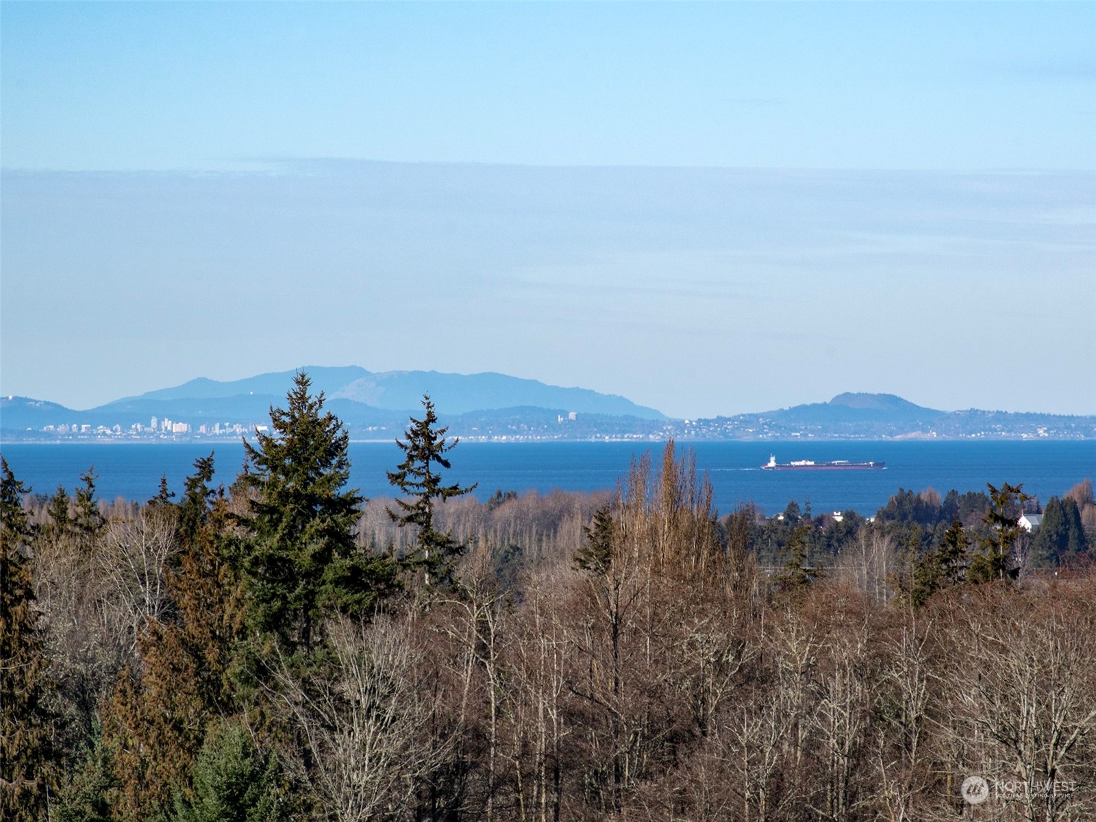 2023 Atterberry Road Sequim, WA 98382 - Photo 2 of 40 a view of a lake with mountains in the background
