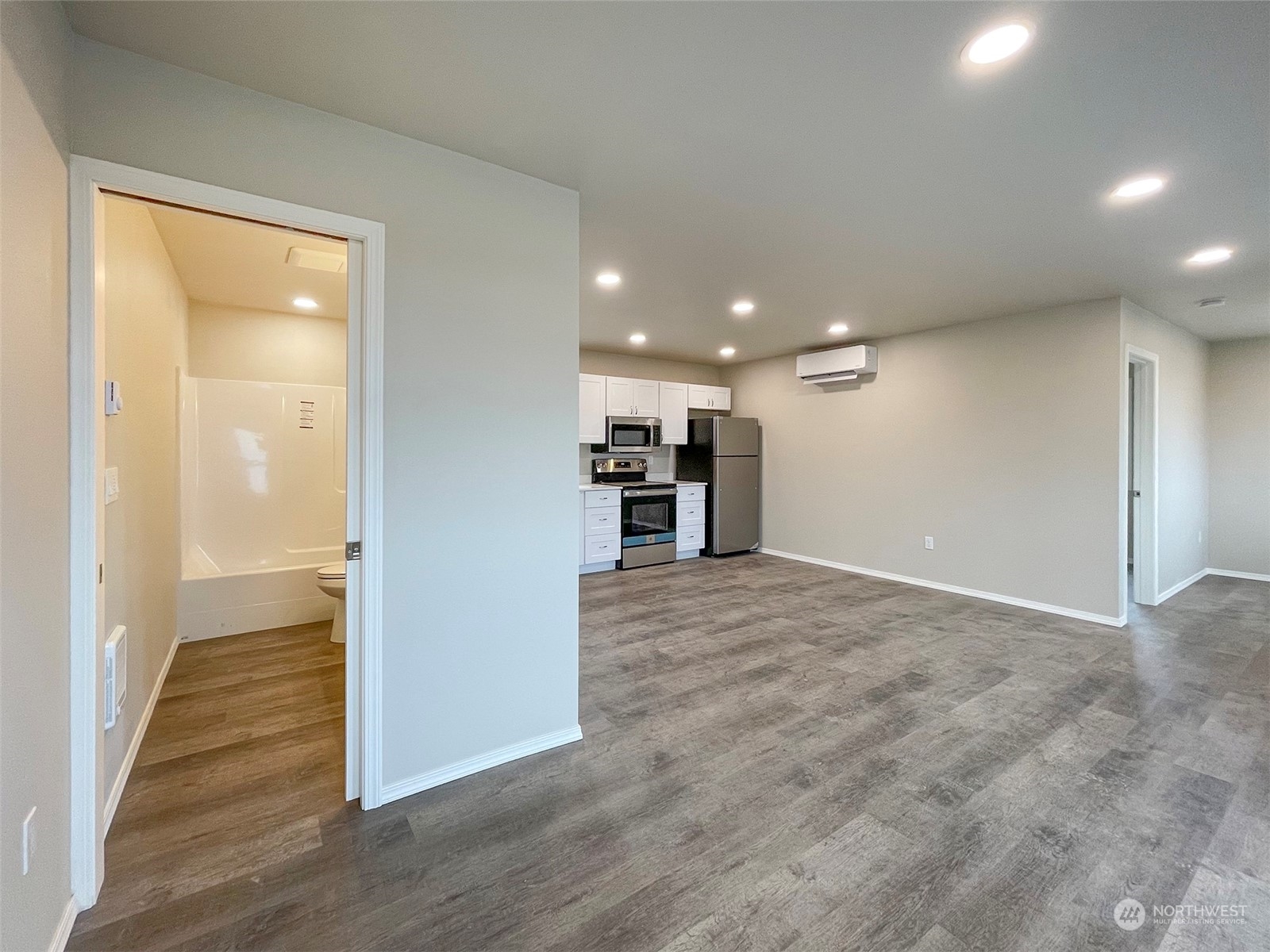 2023 Atterberry Road Sequim, WA 98382 - Photo 23 of 40 a view of a big room with wooden floor and a window
