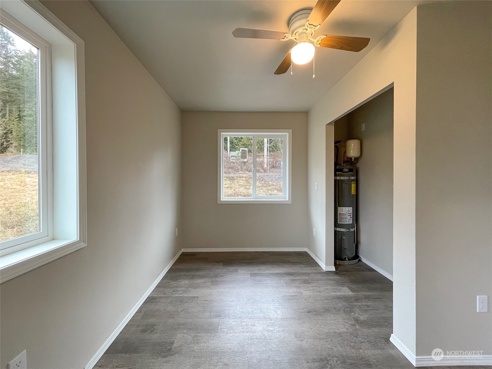 2023 Atterberry Road Sequim, WA 98382 - Photo 26 of 40 en empty room with windows and ceiling fan