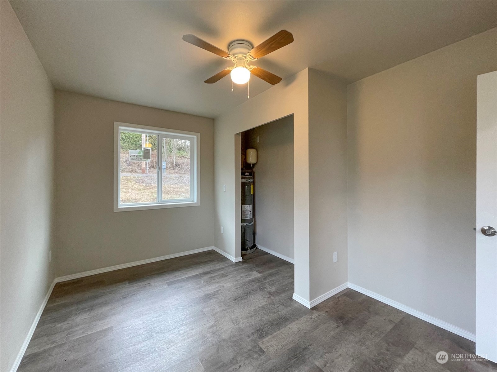 2023 Atterberry Road Sequim, WA 98382 - Photo 27 of 40 an empty room with closet and ceiling fan