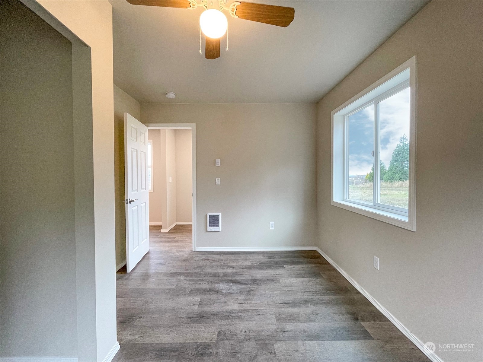 2023 Atterberry Road Sequim, WA 98382 - Photo 28 of 40 a view of an empty room with window and chandelier fan