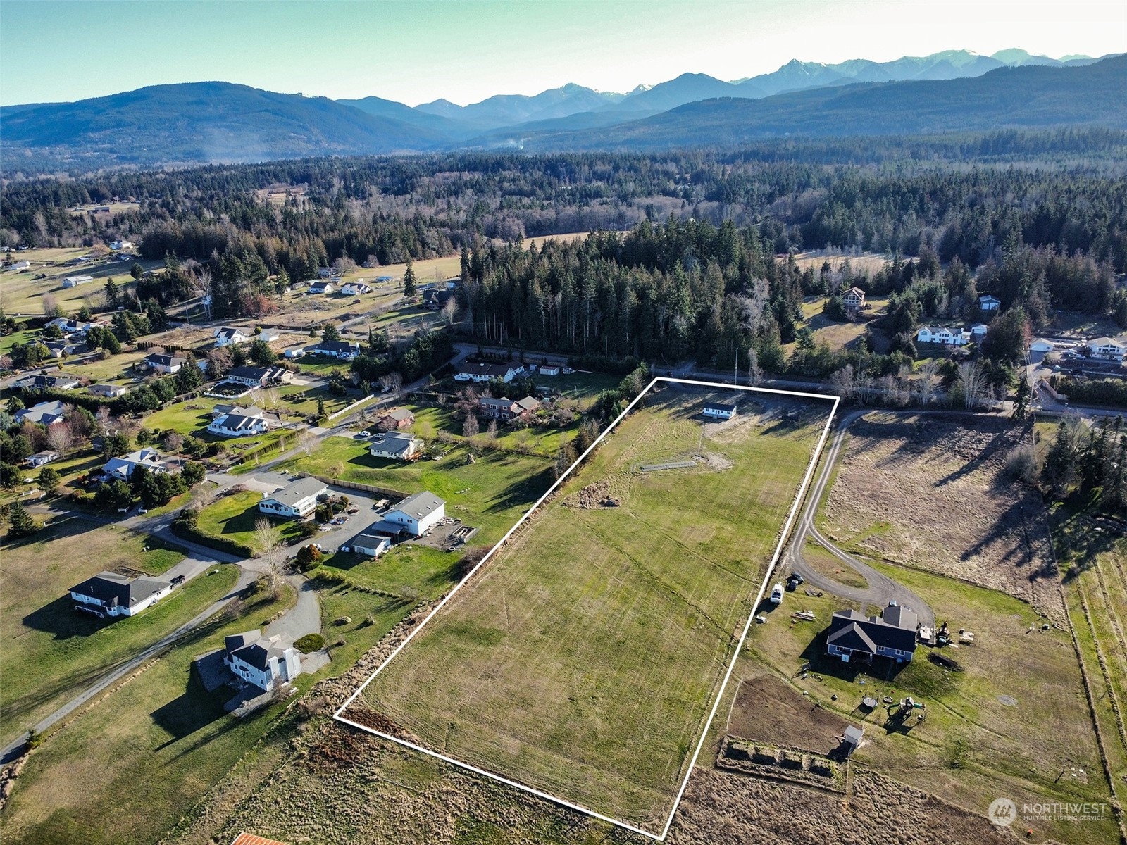 2023 Atterberry Road Sequim, WA 98382 - Photo 34 of 40 a view of a lake with a mountain