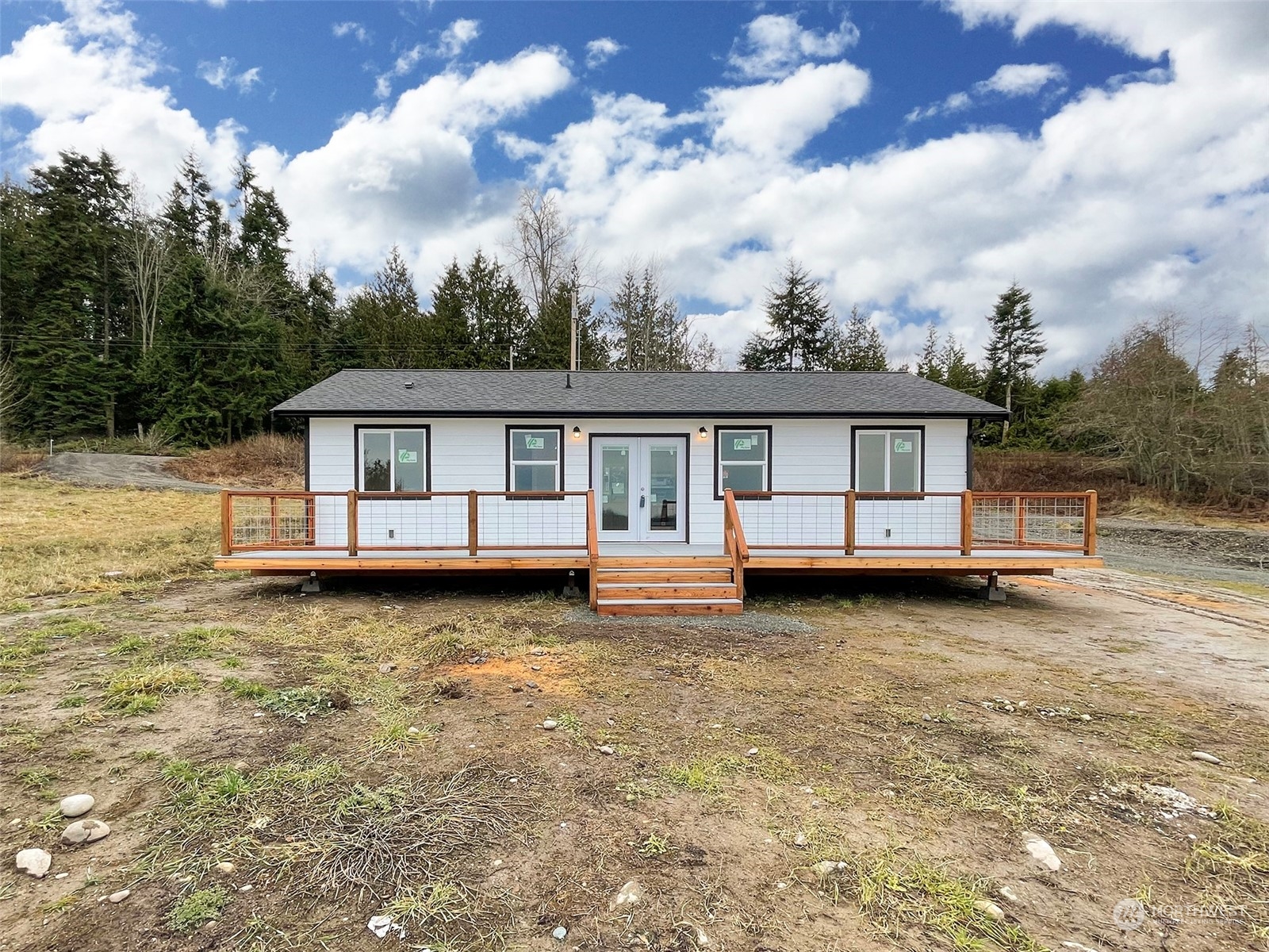 2023 Atterberry Road Sequim, WA 98382 - Photo 6 of 40 a front view of house with yard entertaining space and balcony