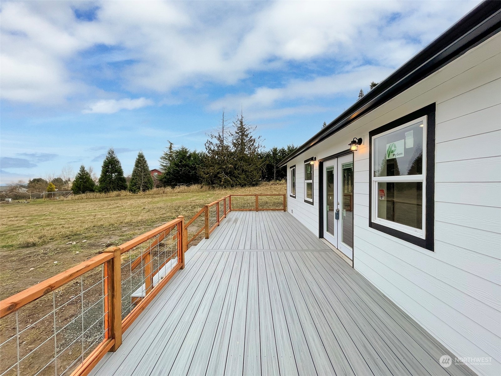 2023 Atterberry Road Sequim, WA 98382 - Photo 7 of 40 a view of balcony with wooden floor and fence