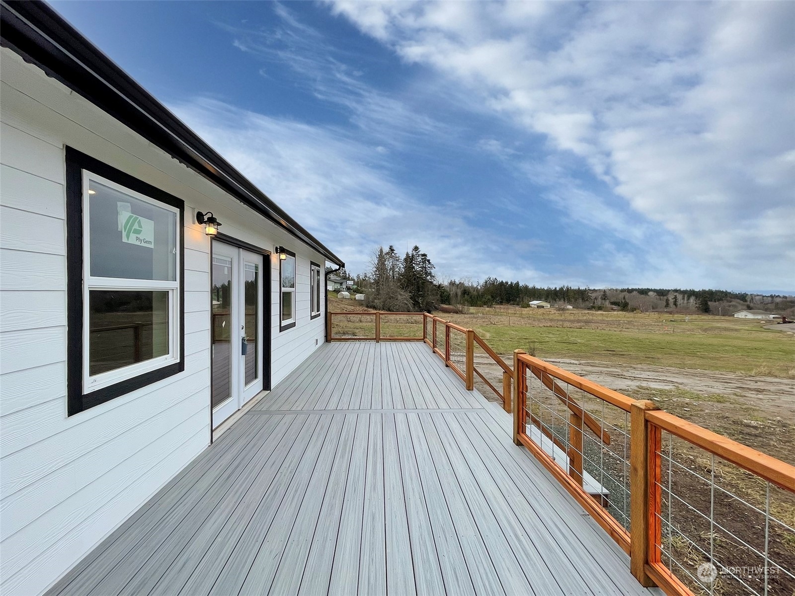 2023 Atterberry Road Sequim, WA 98382 - Photo 8 of 40 a view of balcony with wooden floor and fence