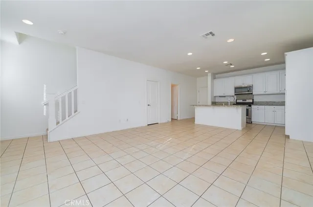 a view of a kitchen with electric appliances