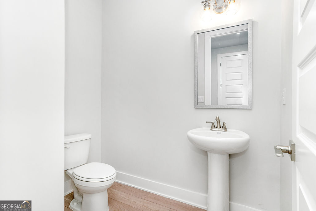 2604 Parkside Way Gainesville, GA 30507 - Photo 10 of 33 a bathroom with a sink toilet and a mirror