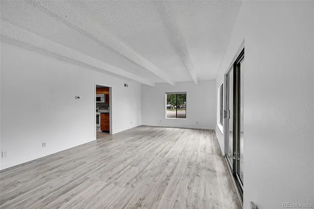 a view of livingroom with hardwood and hallway