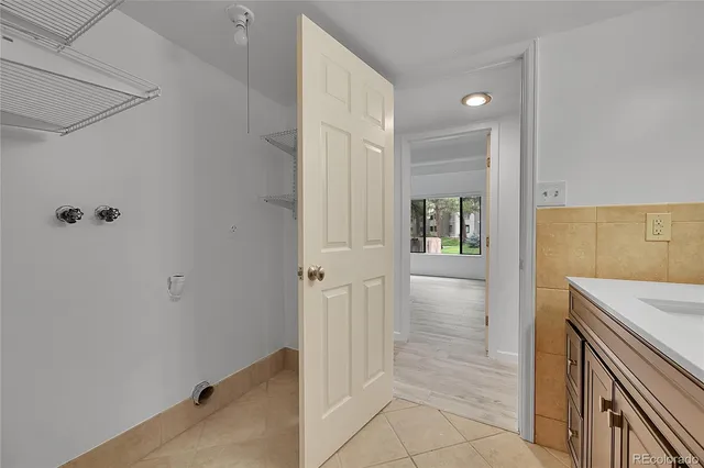 a view of hallway with wooden floor