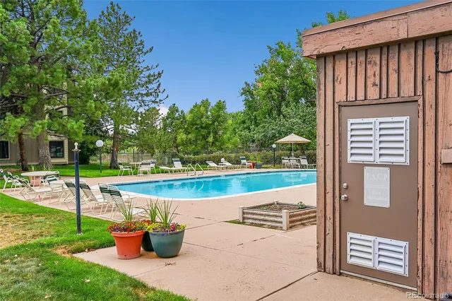a view of a patio with chairs and a table and chairs