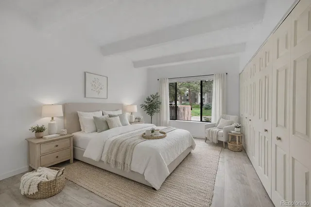 a bedroom with a bed and window