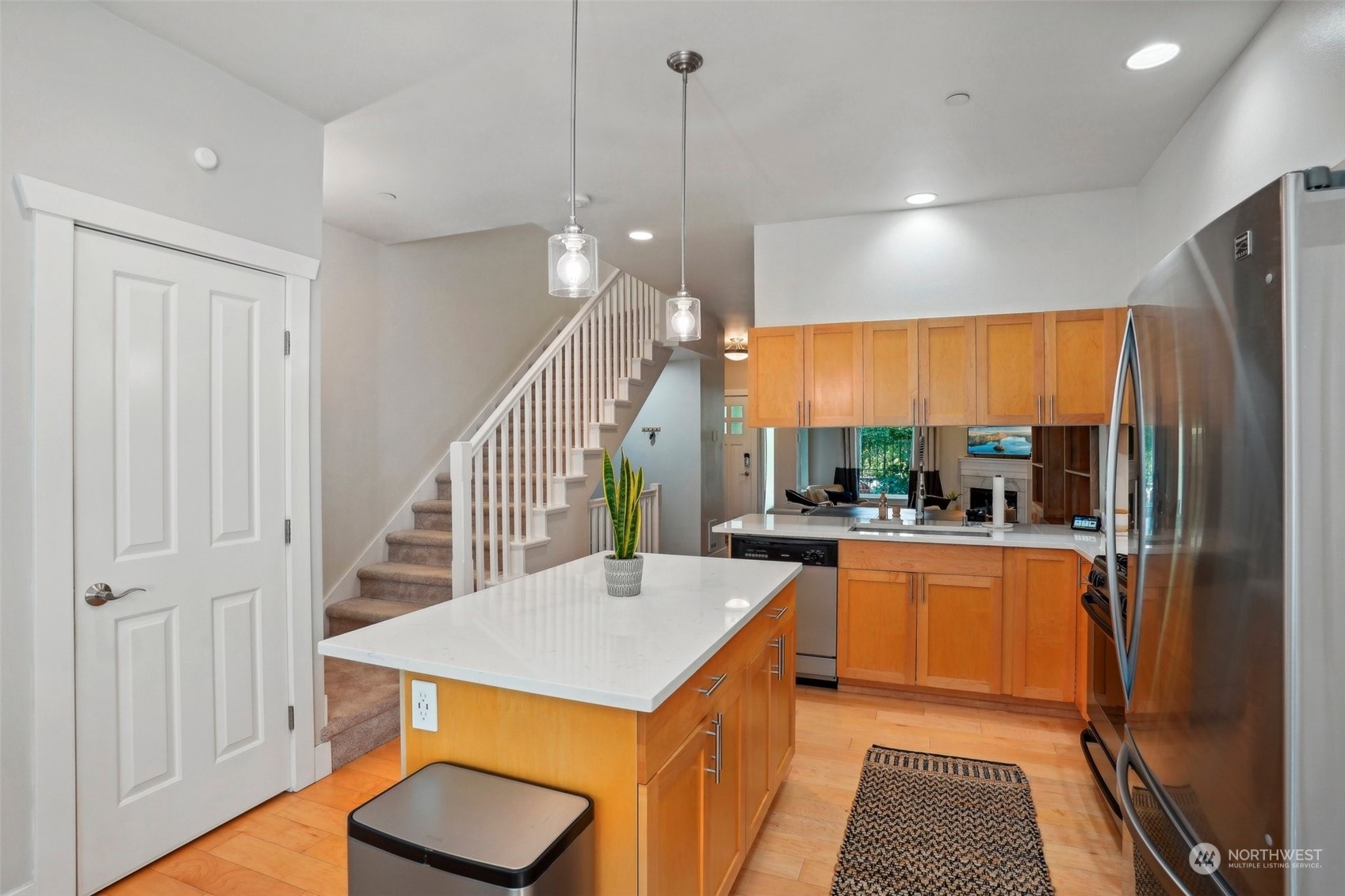 1127 Campbell Way Bremerton, WA 98310 - Photo 19 of 39 a kitchen with a table chairs refrigerator and sink