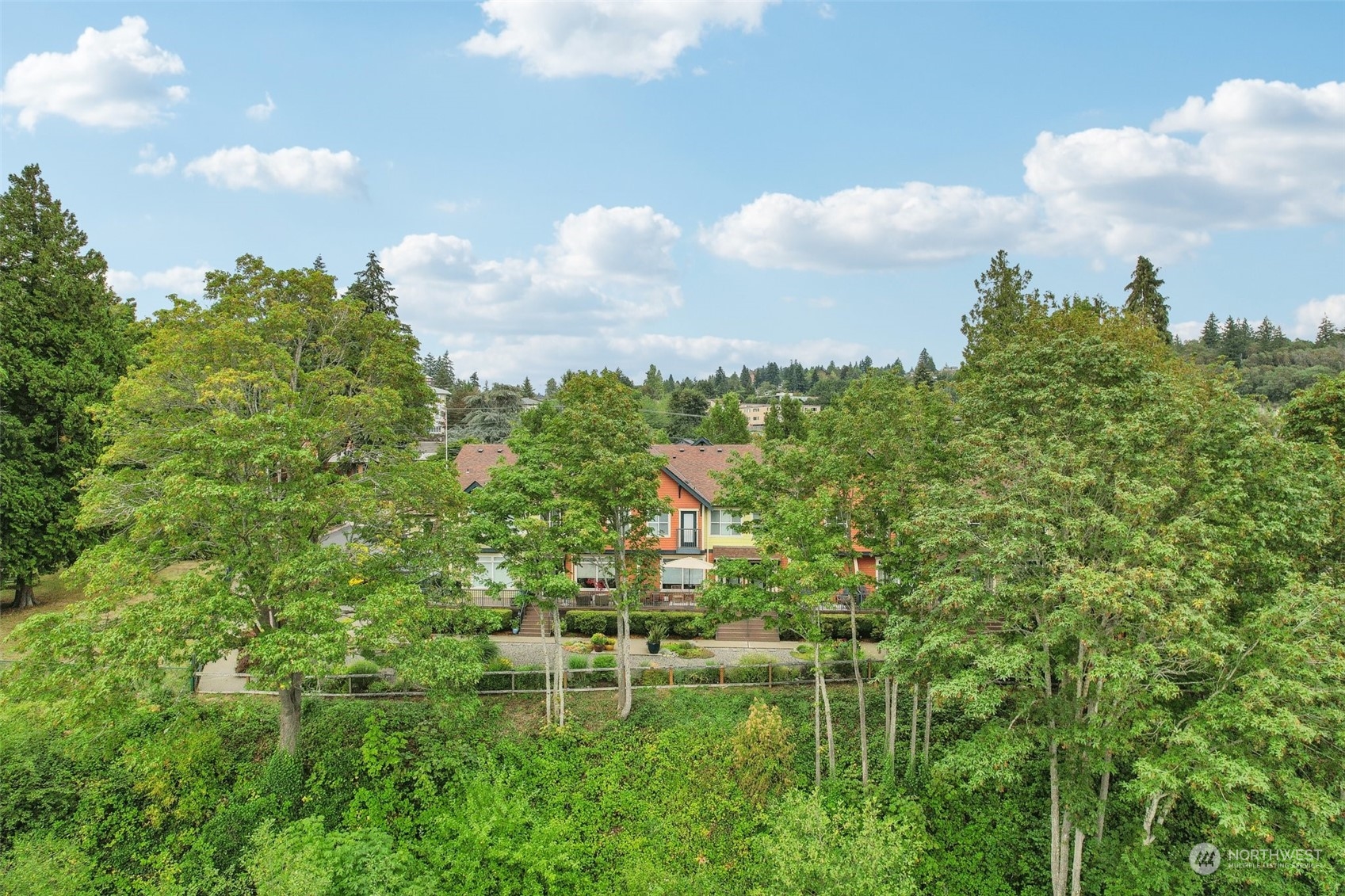 1127 Campbell Way Bremerton, WA 98310 - Photo 36 of 39 a backyard of a house with lots of green space and fog