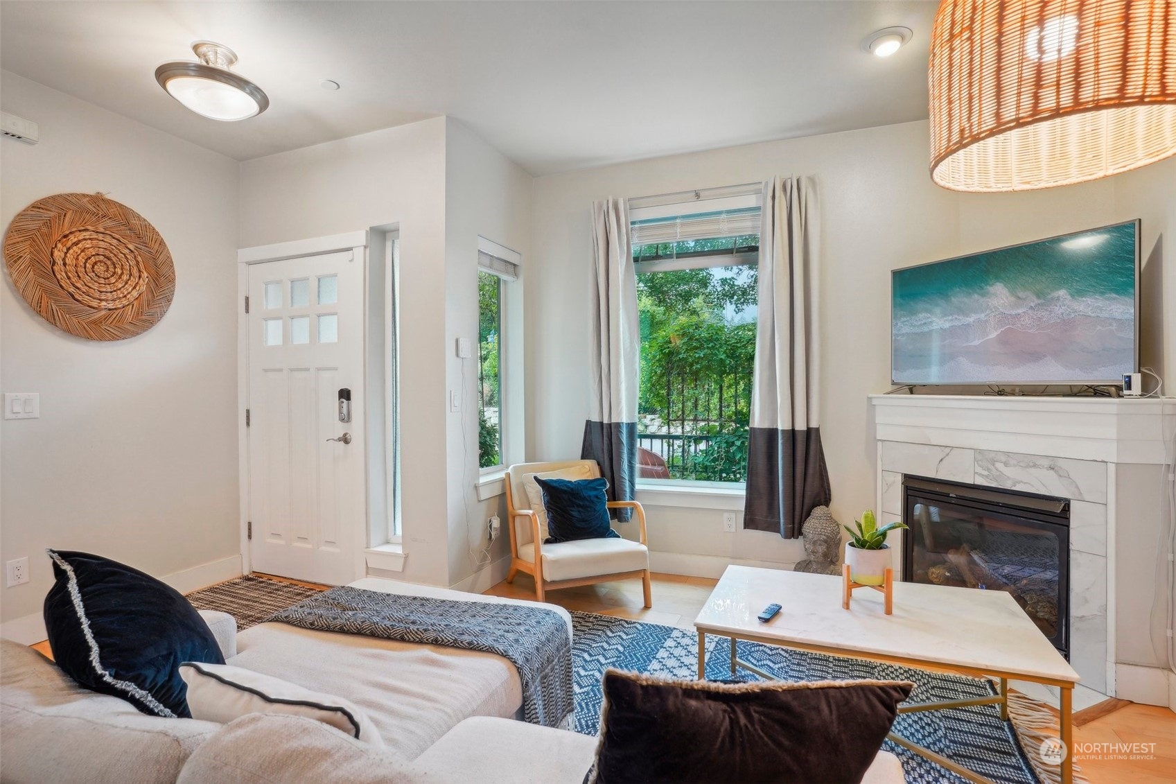 1127 Campbell Way Bremerton, WA 98310 - Photo 8 of 39 a living room with furniture a fireplace and a flat screen tv