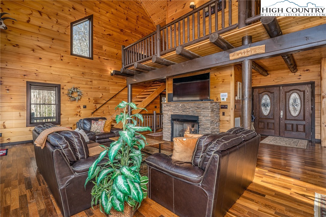 502 Poga Road Butler, TN 37640 - Photo 12 of 50 a view of a patio with couches chairs and a fireplace