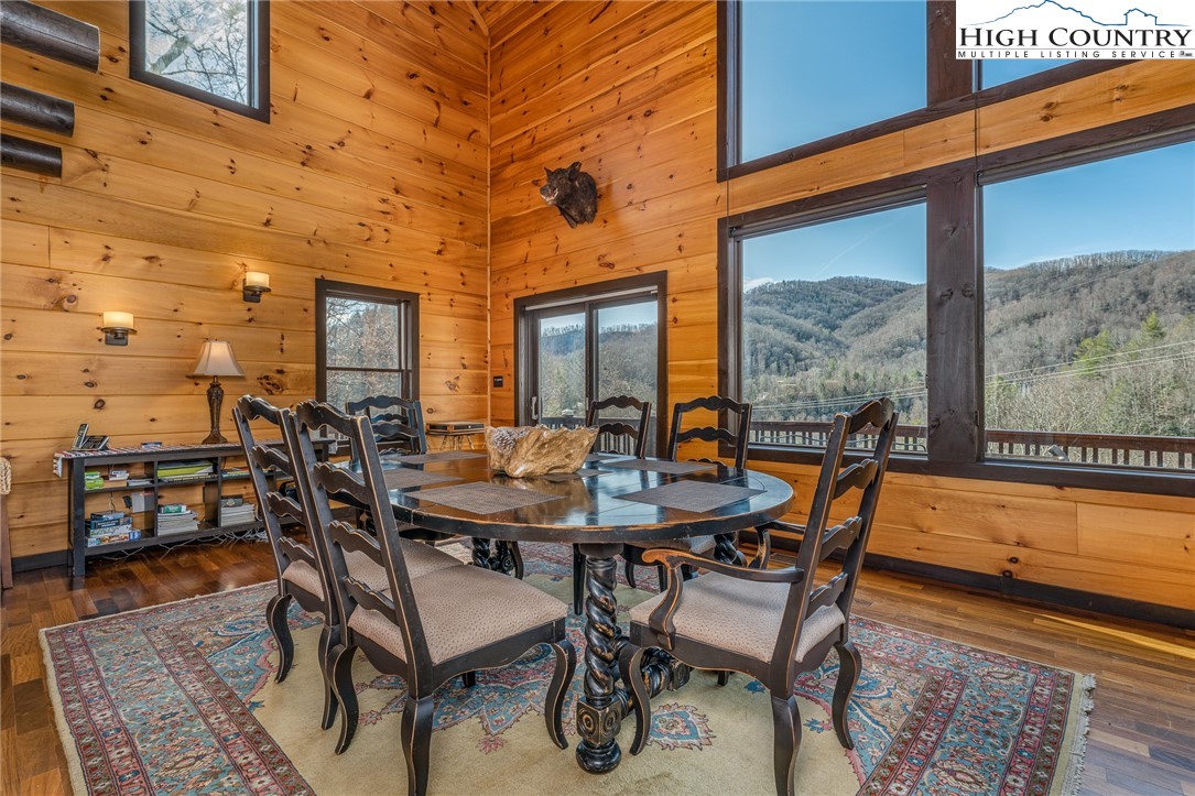 502 Poga Road Butler, TN 37640 - Photo 17 of 50 a dining room with furniture and wooden floor