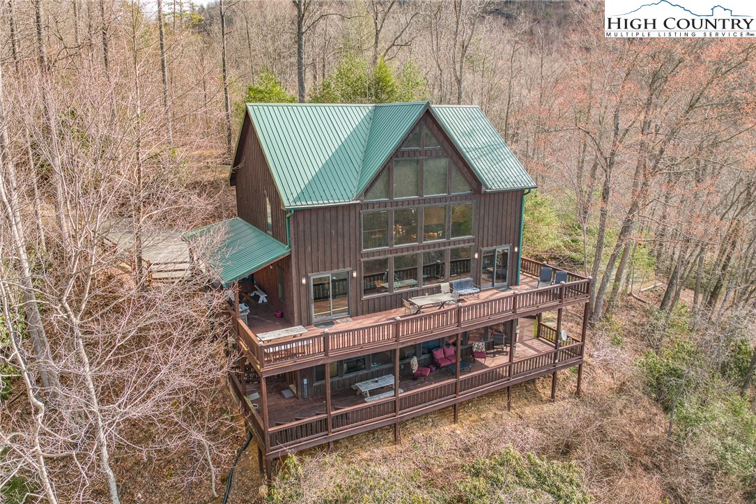 502 Poga Road Butler, TN 37640 - Photo 5 of 50 a view of house with outdoor space and seating area