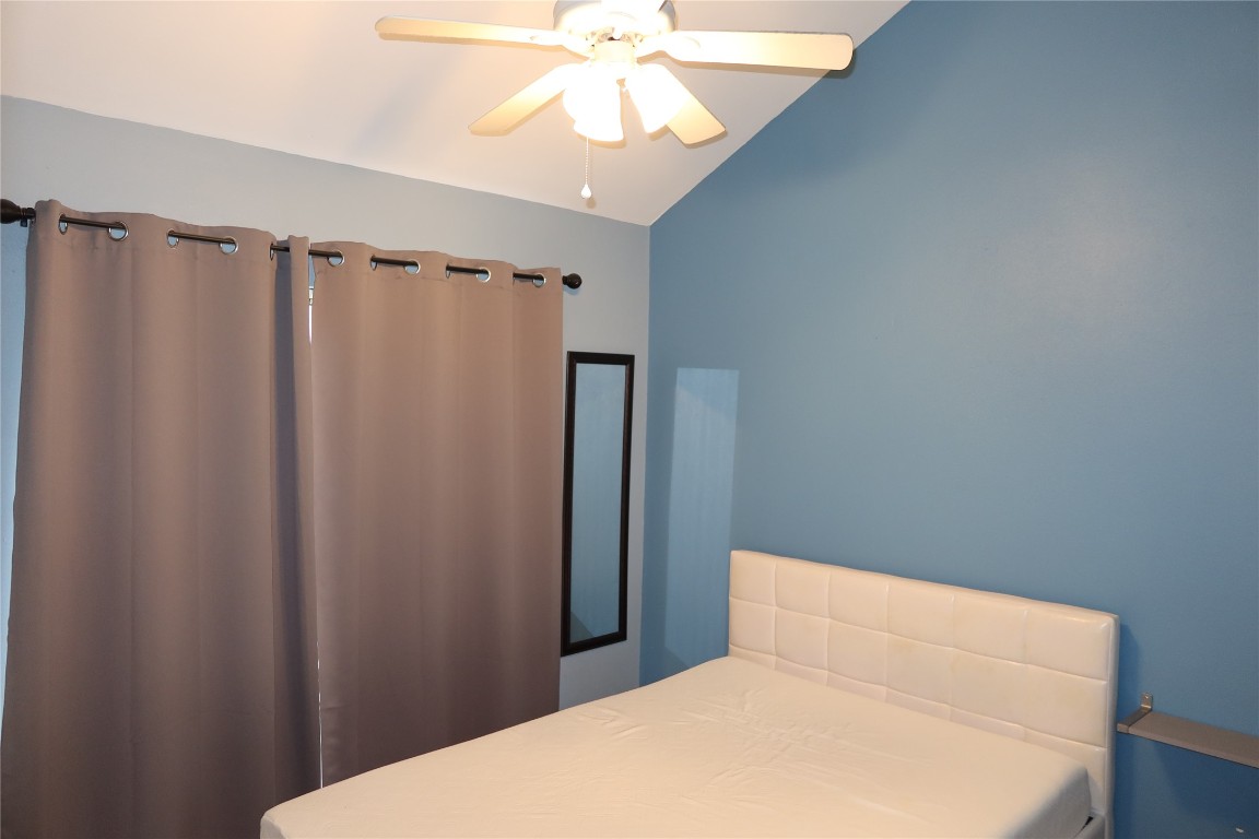2210 Pearl Street, Unit 303 Austin, TX 78705 - Photo 12 of 23 a bedroom with a bed and a window