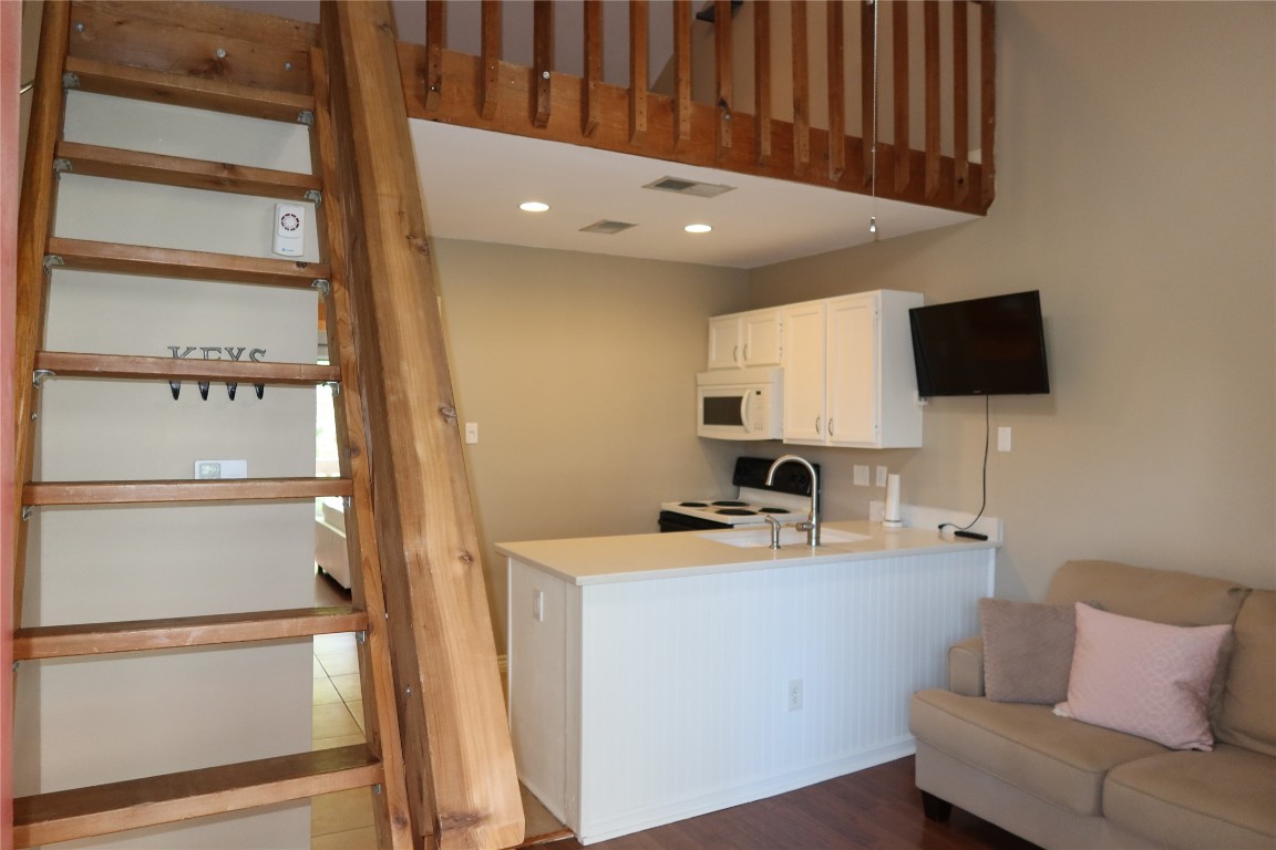 2210 Pearl Street, Unit 303 Austin, TX 78705 - Photo 17 of 23 a room with furniture and a flat screen tv