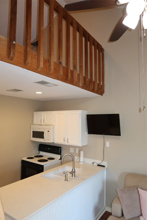 2210 Pearl Street, Unit 303 Austin, TX 78705 - Photo 21 of 23 a kitchen with stainless steel appliances a sink a stove top oven a chimney and a refrigerator