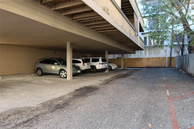 a car parked in parking area of a house