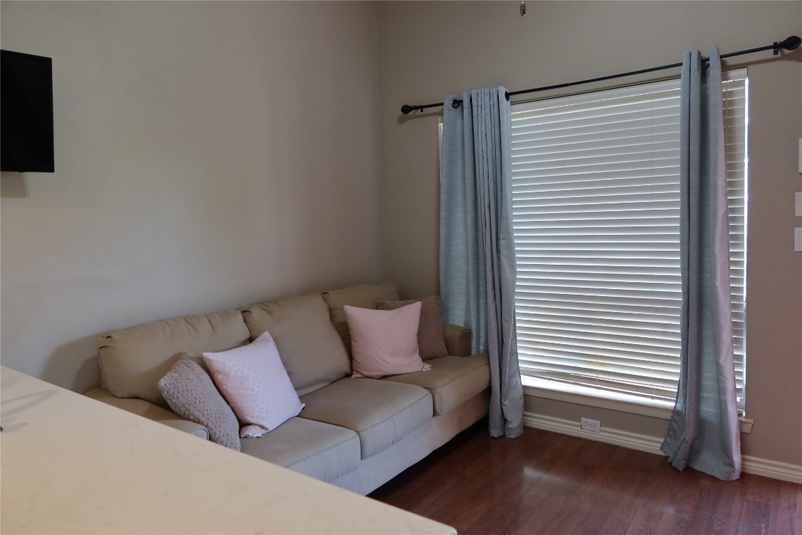 2210 Pearl Street, Unit 303 Austin, TX 78705 - Photo 4 of 23 a living room with furniture and a window