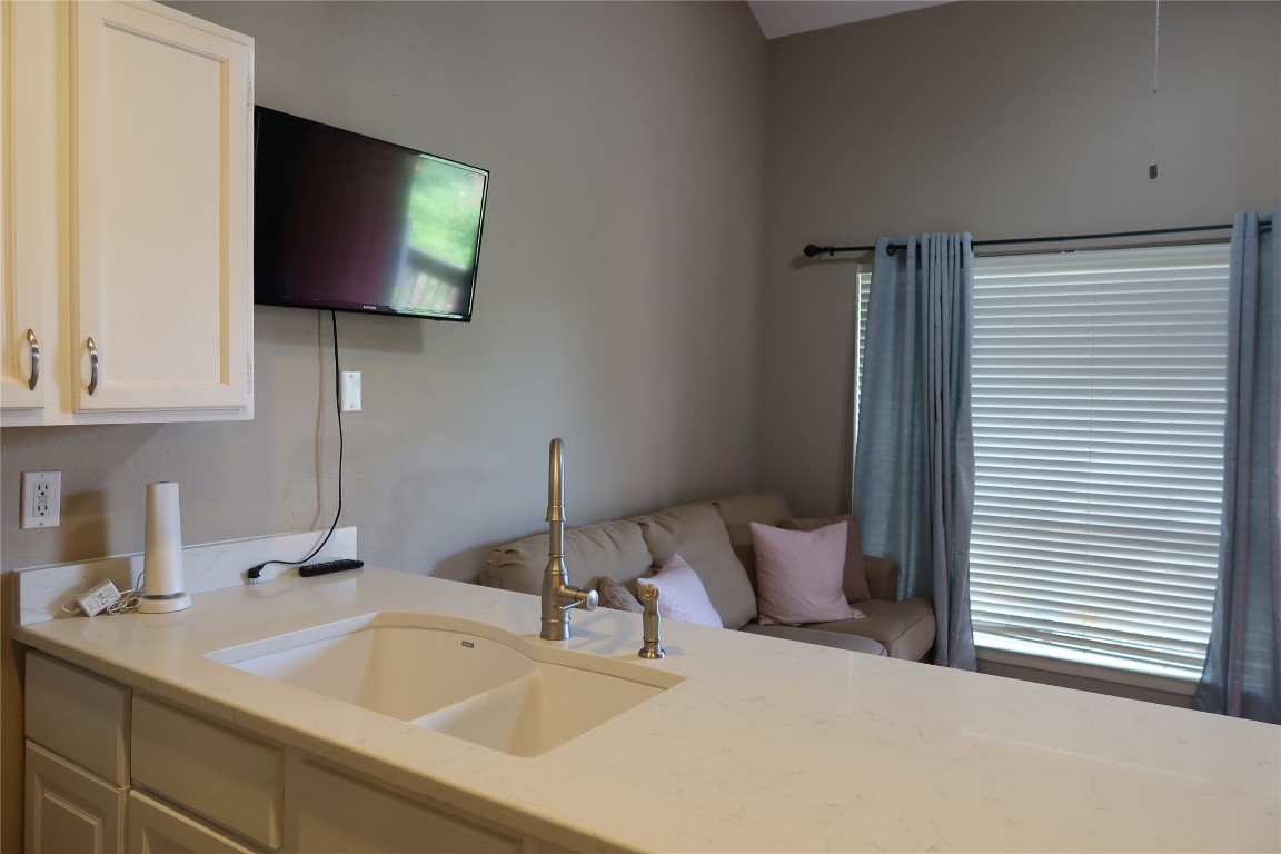 2210 Pearl Street, Unit 303 Austin, TX 78705 - Photo 8 of 23 a bathroom with a sink and a mirror