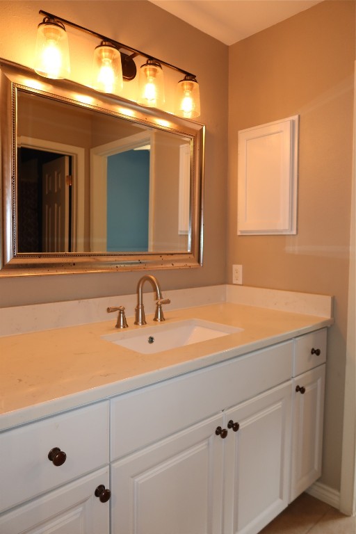 2210 Pearl Street, Unit 303 Austin, TX 78705 - Photo 10 of 23 a bathroom with a sink and a mirror