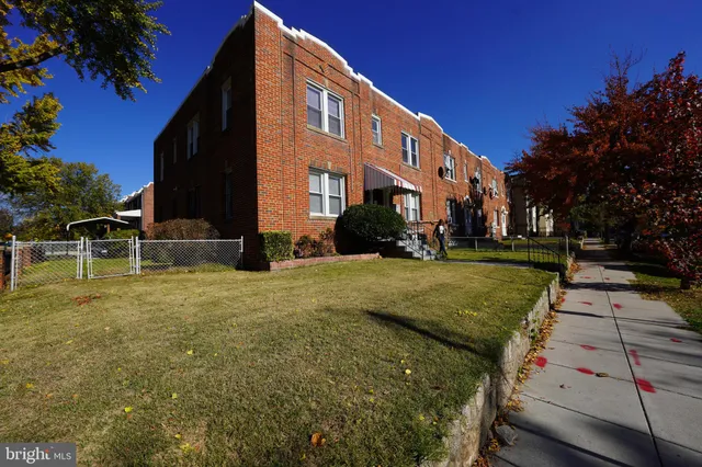 a view of a building with a yard