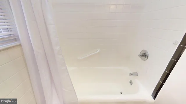 a close up of a bathtub in a bathroom
