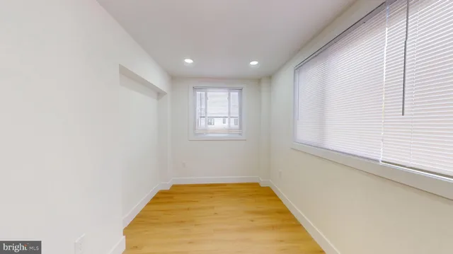 a view of a room with windows