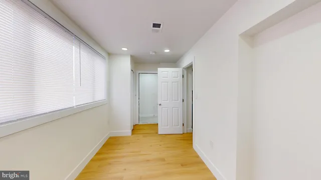 a view of hallway with a large window