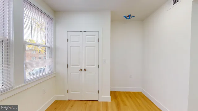 a bathroom with a tub and window