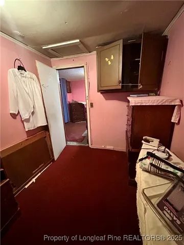 a view of a livingroom with furniture and staircase