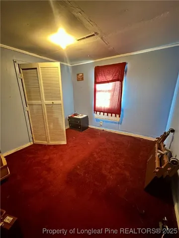 a view of an empty room and a window