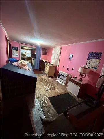 a bedroom with furniture and window