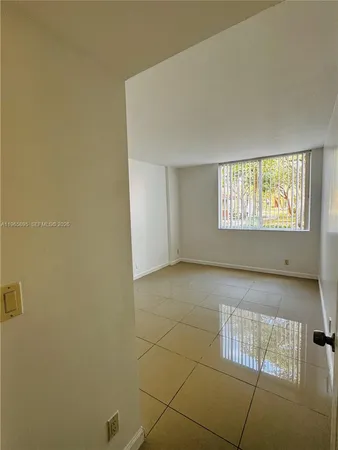 a view of an empty room and window