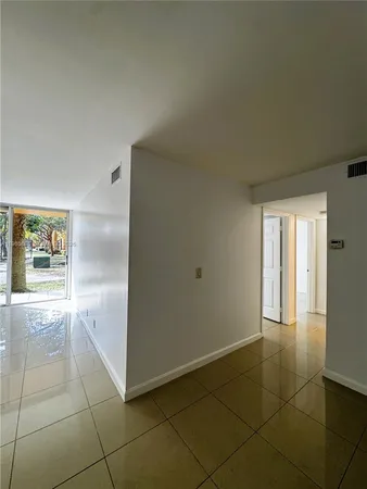 a view of an empty room and window