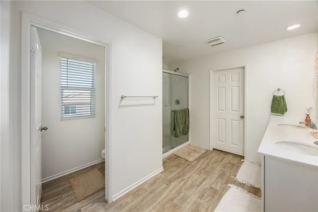 a bedroom with a bed and a table