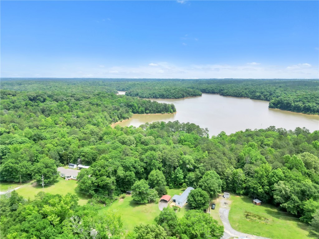 506 Charlies Creek Road Iva, SC 29655 - Photo 2 of 28 A private estate with a tranquil lake and verdant forest views awaits.