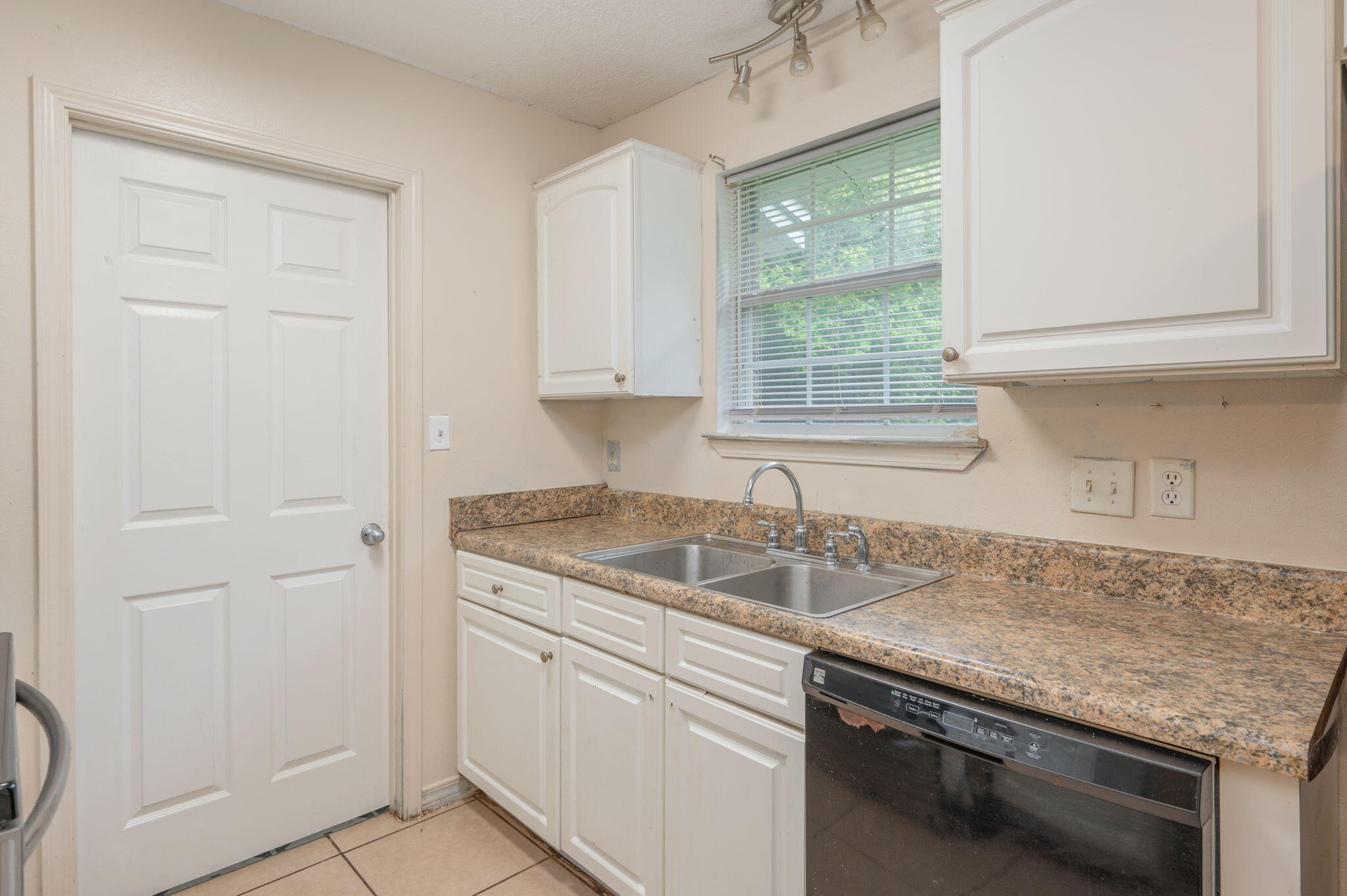 834 McDonald Street Crestview, FL 32536 - Photo 8 of 35 a kitchen with granite countertop cabinets sink and window