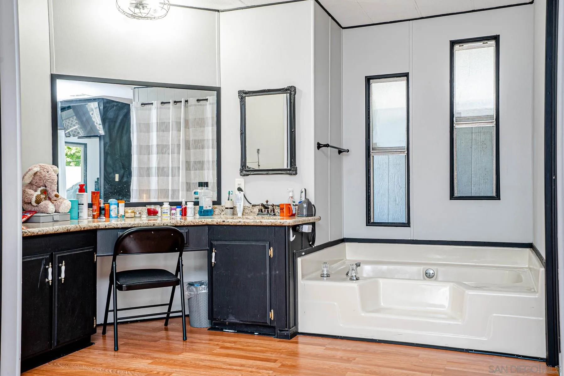10880 Highway 67, Unit 17 Lakeside, CA 92040 - Photo 15 of 20 a bathroom with a sink and a mirror