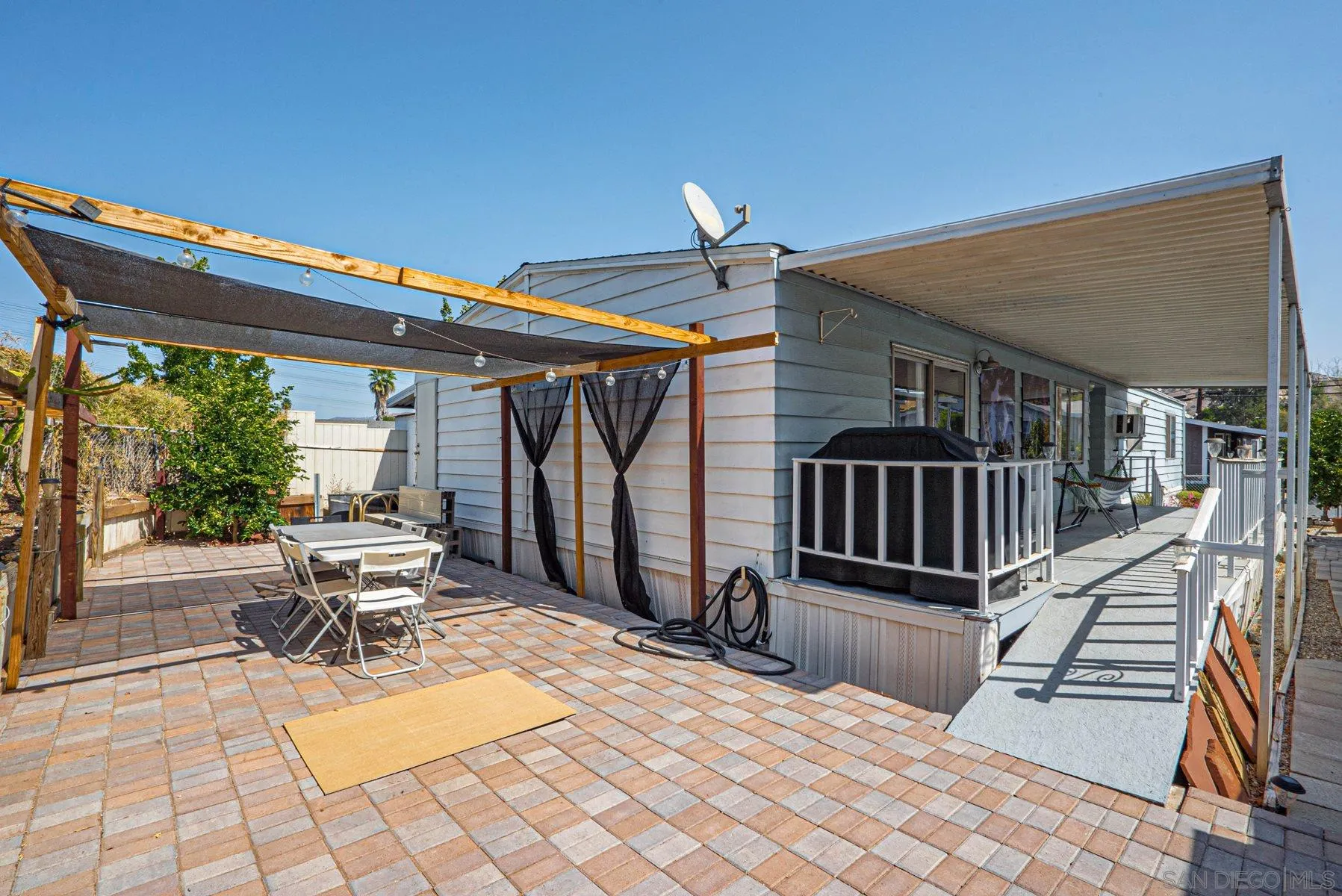 10880 Highway 67, Unit 17 Lakeside, CA 92040 - Photo 3 of 20 a view of a patio with a table and chairs