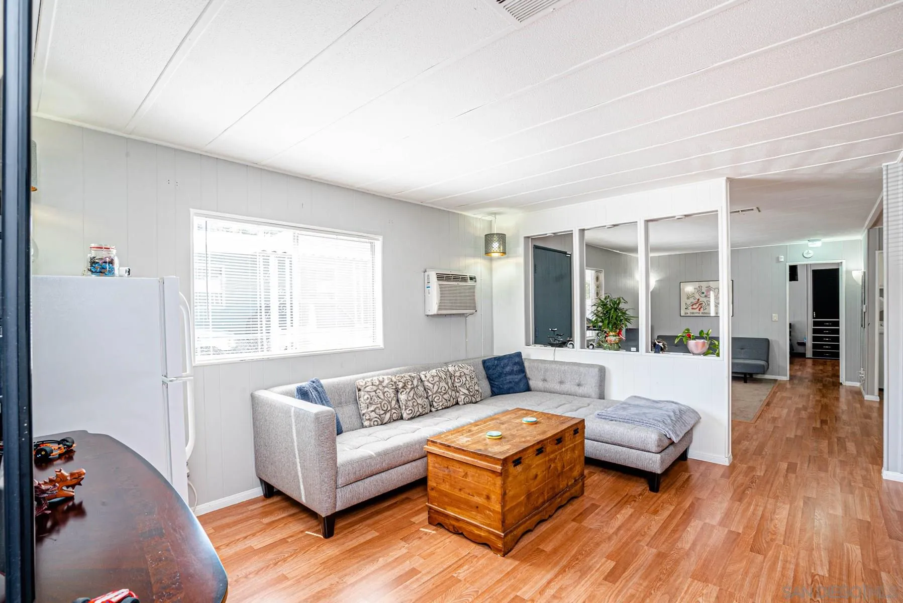 10880 Highway 67, Unit 17 Lakeside, CA 92040 - Photo 8 of 20 a living room with furniture and a large window