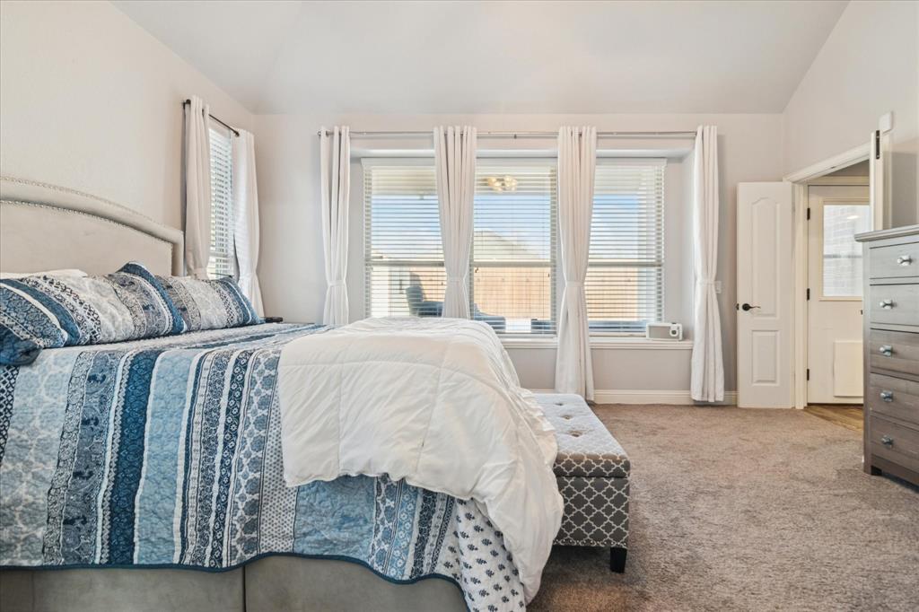 3605 Dogwood Road Melissa, TX 75454 - Photo 12 of 25 a spacious bedroom with a bed a table and large windows