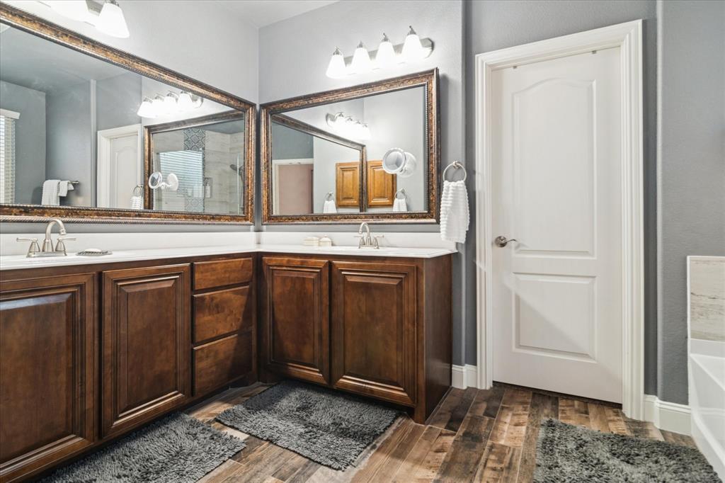 3605 Dogwood Road Melissa, TX 75454 - Photo 13 of 25 a spacious bathroom with a granite countertop sink and a mirror