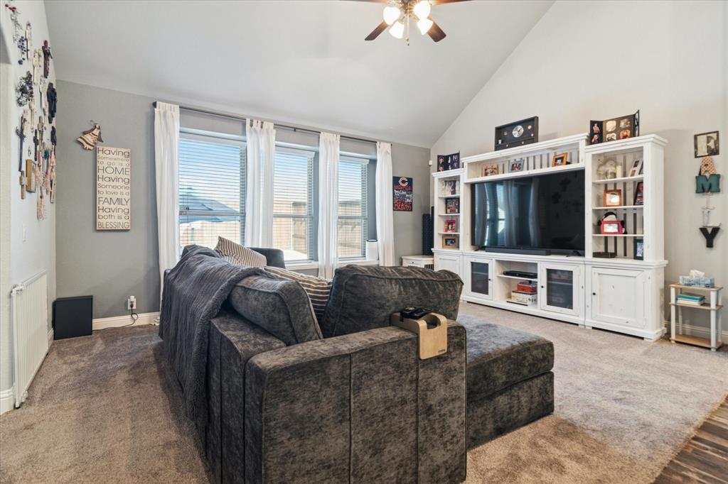 3605 Dogwood Road Melissa, TX 75454 - Photo 7 of 25 a living room with furniture and a flat screen tv