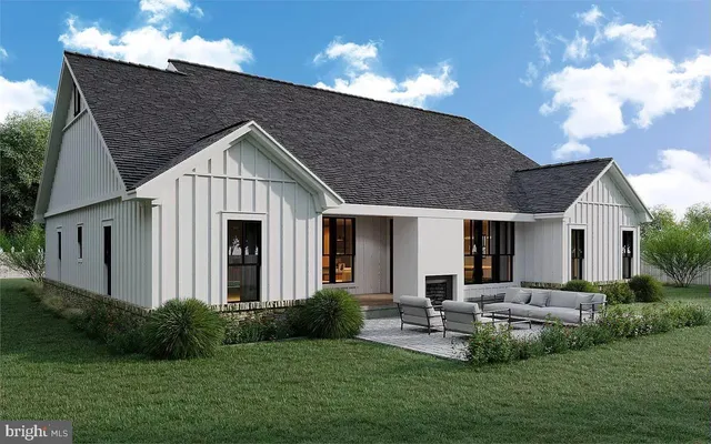 a view of a house with backyard and garden